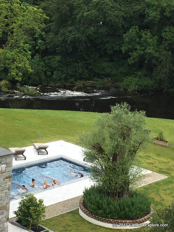 A view of the hot tubs and the river Galgorm Resort and Spa Northern Ireland 